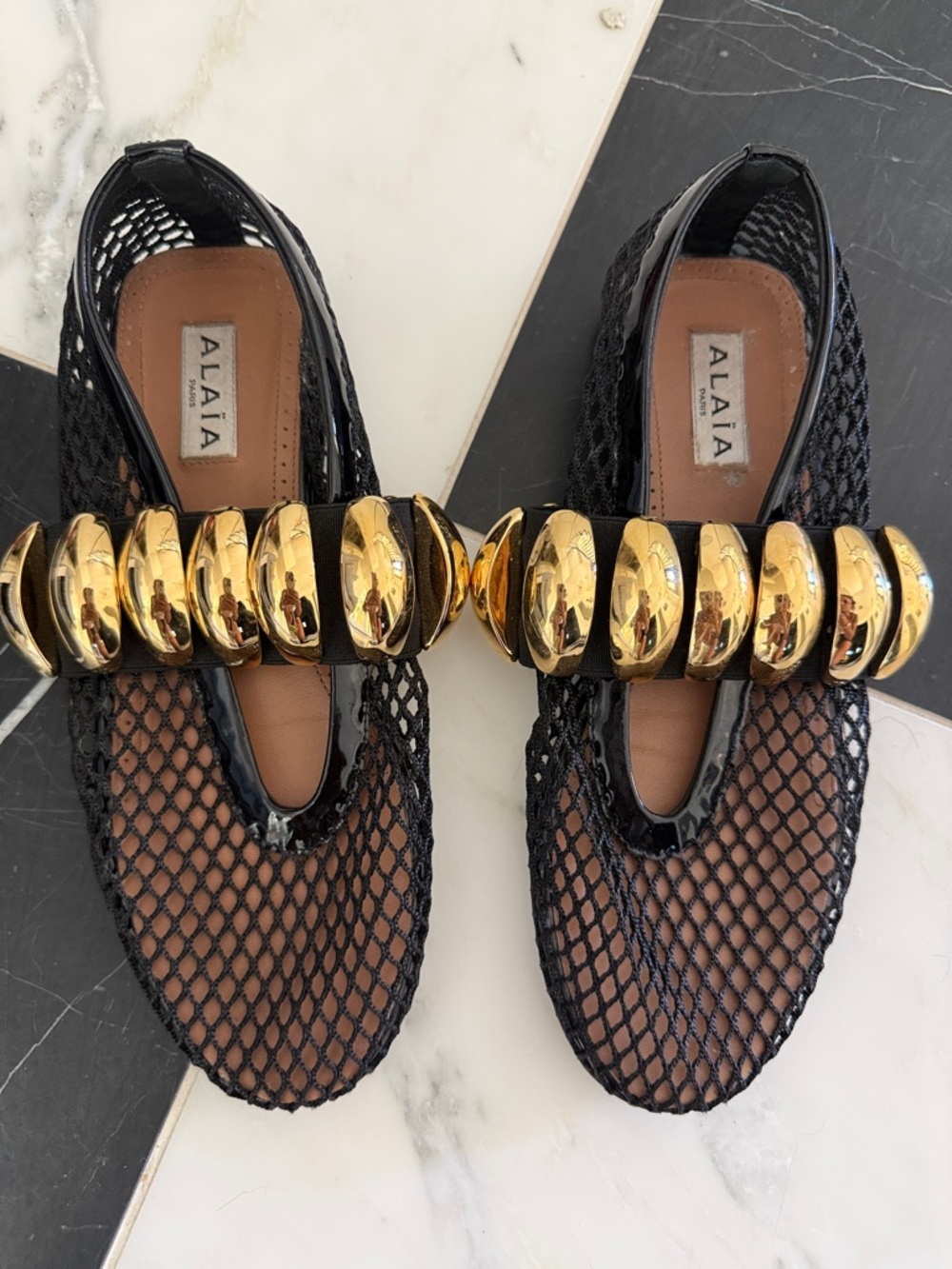 Alaia 2026 Black Mesh Ballet Flats with Gold Orb Detail